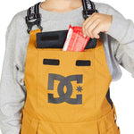 DC Juniors Roadblock Bib 2023 - A pair of bib snow pants with a black and white geometric pattern on the left leg.