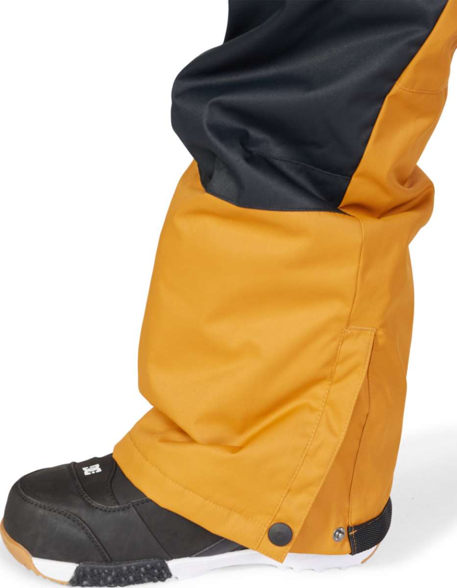 DC Juniors Roadblock Bib 2023 - Black bib with white logo on left thigh and black zipper.