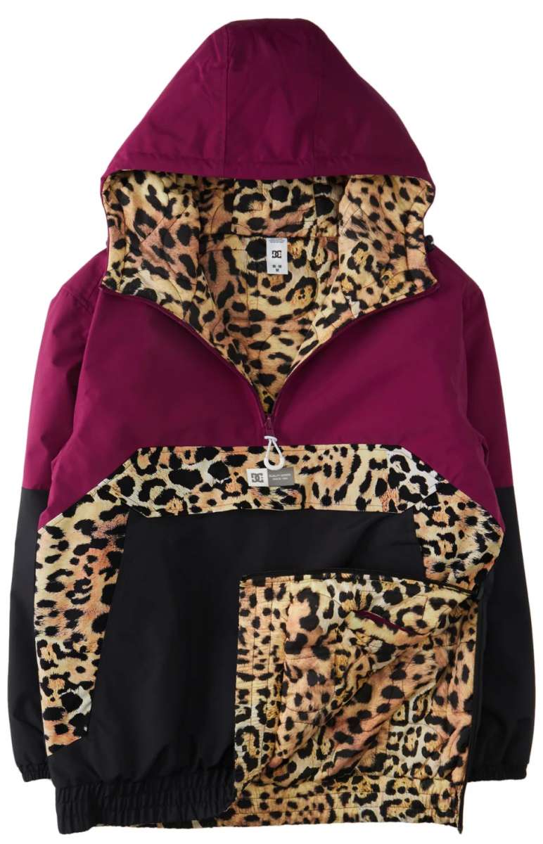 DC Women's Nexus Reversible Anorak Jacket 2024 - A black jacket with a leopard print lining and a hood, featuring a zipper closure.