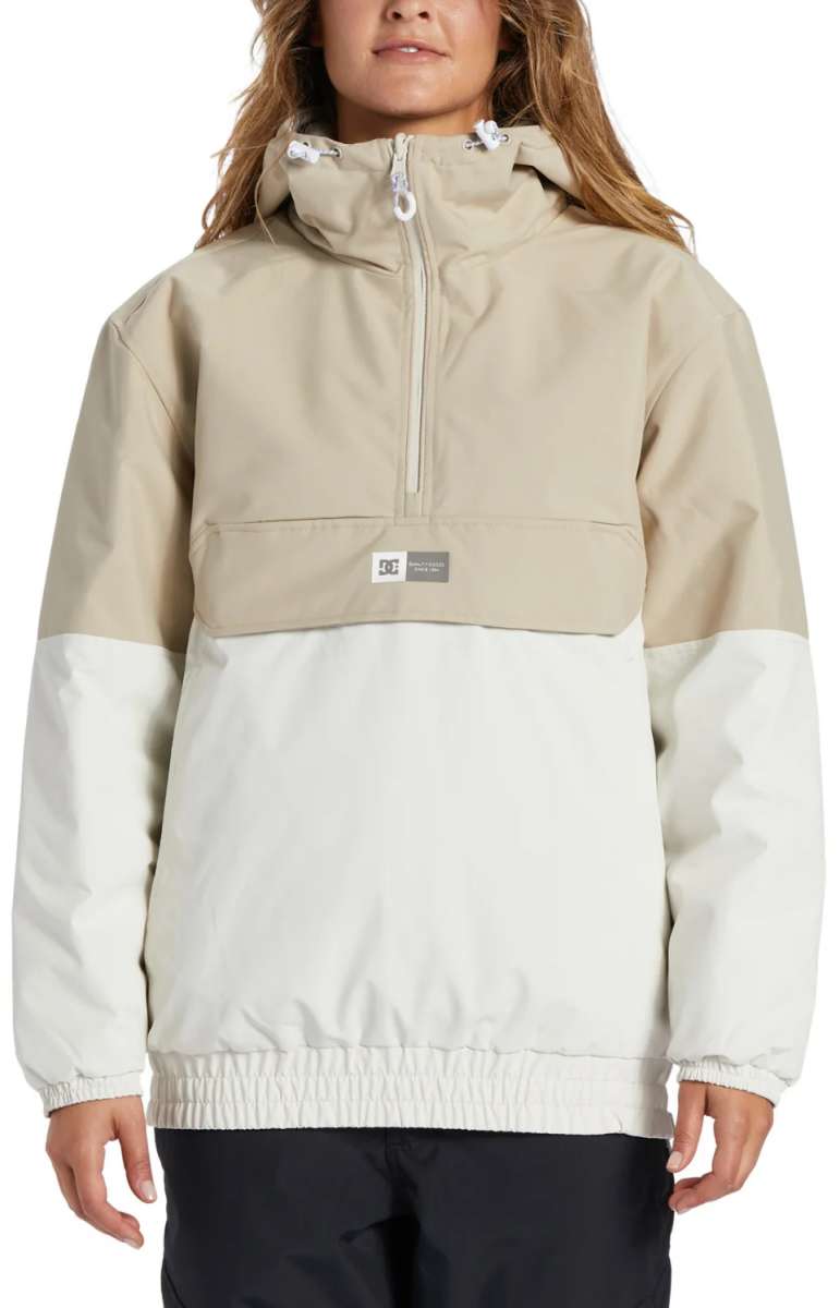 DC Women's Nexus Reversible Anorak Jacket 2024 - A tan and white jacket with a hood, featuring a zipper closure at the front.