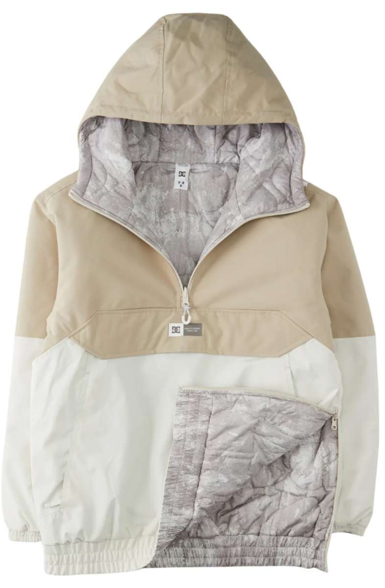 DC Women's Nexus Reversible Anorak Jacket 2024 - A tan and white jacket with a hood, featuring a zipper closure at the front.