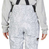 DC Women's Collective Shell Bib 2023 - White snow pants with a subtle gray pattern of abstract shapes and lines, featuring black suspenders and gold buckles.