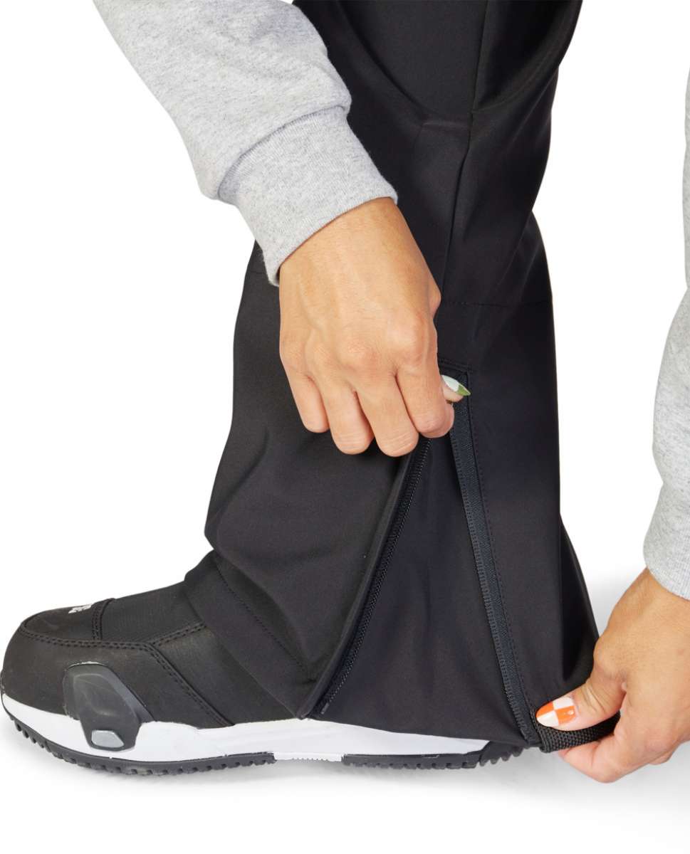 DC Women's Collective Shell Bib 2023 - Black bib with white logo on left thigh and black zipper down center front.