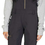 DC Women's Collective Shell Bib 2023 - Black bib with gold zipper, black straps and buckles on waist.