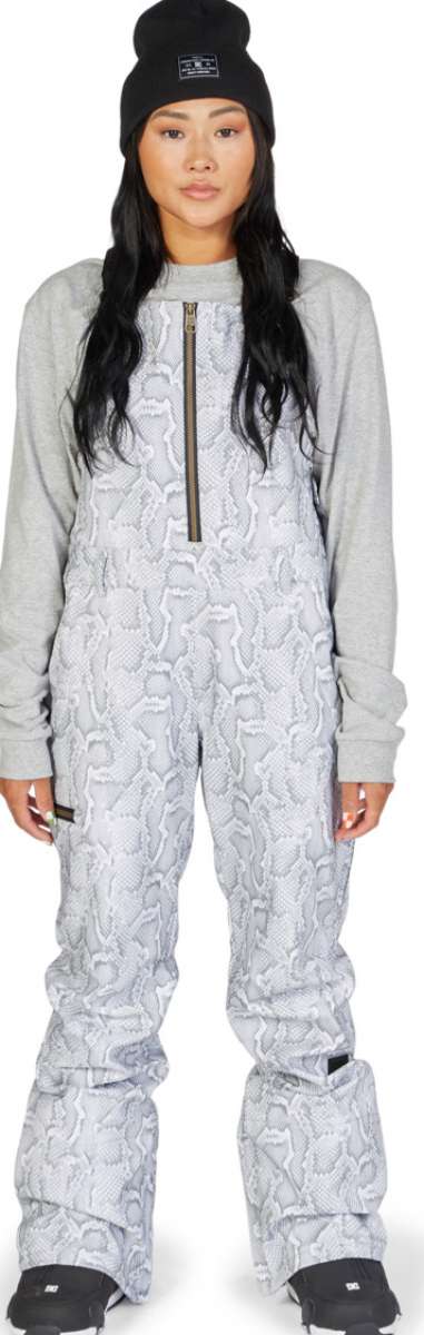 DC Women's Collective Shell Bib 2023 - Black bib with white snowflake pattern and black zipper.