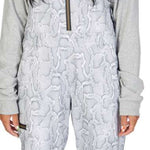 DC Women's Collective Shell Bib 2023 - Black bib with white snowflake pattern and black zipper.