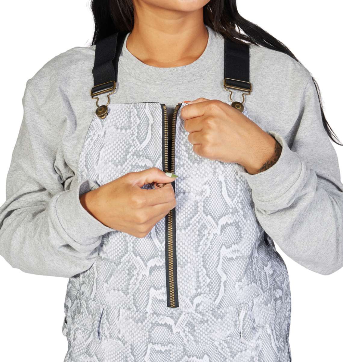 DC Women's Collective Shell Bib 2023 - A woman wearing a gray bib with a snakeskin pattern and black suspenders.