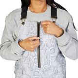 DC Women's Collective Shell Bib 2023 - A woman wearing a gray bib with a snakeskin pattern and black suspenders.