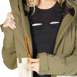 DC Women's Cruiser Insulated Jacket 2023 - A black jacket with a white logo on the left chest and a zippered pocket on the right side.