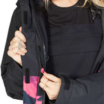 DC Women's Cruiser Insulated Jacket 2023 - A black jacket with a pink and grey tie-dye pattern on the lower portion of the sleeves and bottom hem.