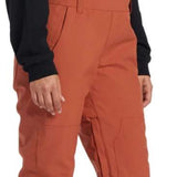 DC Women's Crusade Shell Bib Pant 2024 - A pair of burnt orange snow pants with a zippered pocket on the thigh and adjustable straps at the waist.