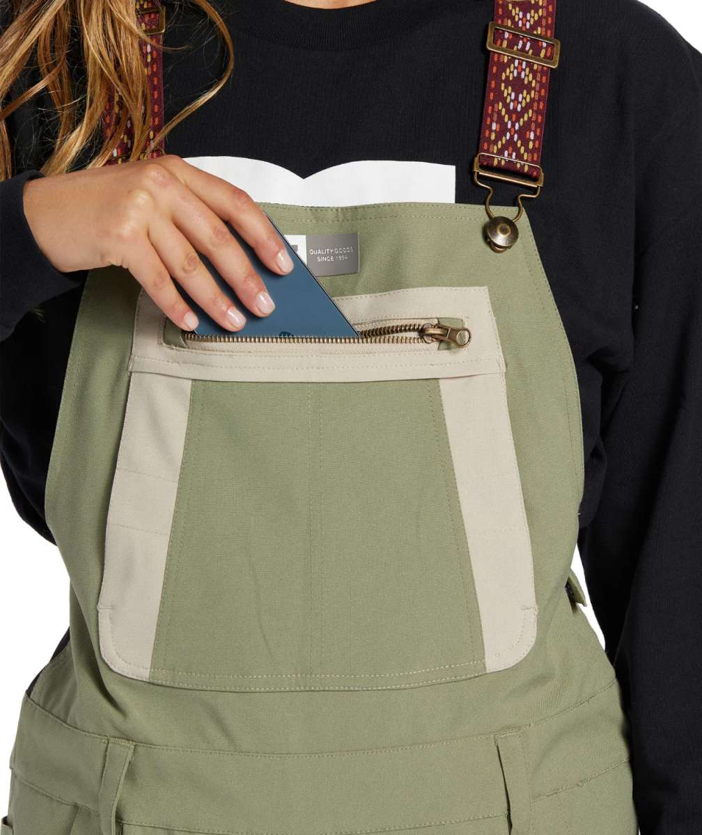 DC Women's Crusade Shell Bib Pant 2024 - Black bib with white trim and reflective logo on left thigh.