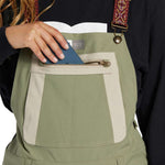 DC Women's Crusade Shell Bib Pant 2024 - Black bib with white trim and reflective logo on left thigh.