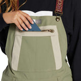 DC Women's Crusade Shell Bib Pant 2024 - Black bib with white trim and reflective logo on left thigh.