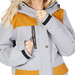 DC Women's Liberate Insulated Jacket 2023 - A black and white striped jacket with yellow accents on the chest, shoulders, and bottom hem.