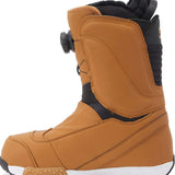 DC Women's Mora BOA Snowboard Boots 2024 - A tan snowboard boot with a black strap and buckle on the side, featuring a brown logo on the back.