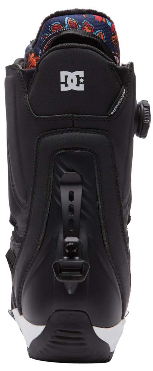 DC Women's Mora Step On Snowboard Boot 2023 - A black snowboard boot with a white logo on the back and a blue, red, orange, and yellow patterned strap.