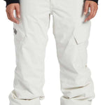 DC Women's Nonchalant Insulated Pant 2024 - White snow pants with a zippered pocket on the left thigh and a black logo patch on the right thigh.