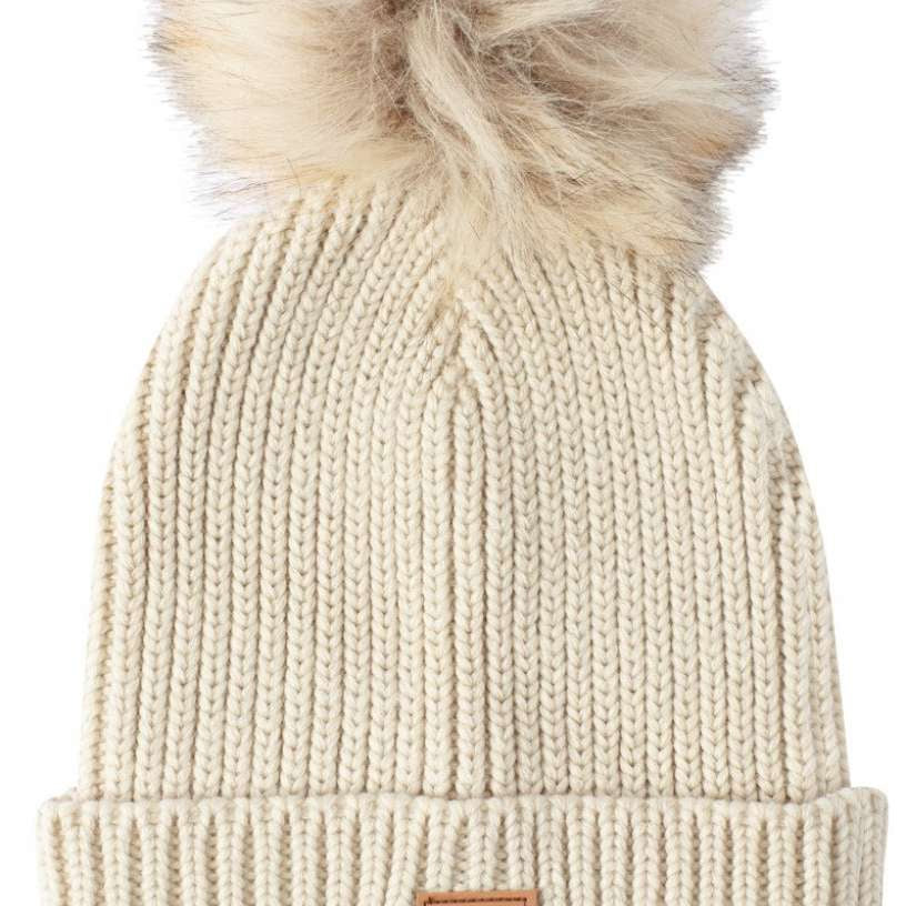DC Women's Splendid Beanie 2022 - A cream-colored beanie with a faux fur pom-pom on top.