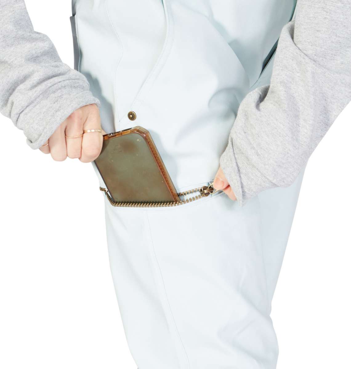 DC Women's Viva Shell Pant 2023 - Black pants with a subtle white pattern on the left leg, worn by a model from behind.