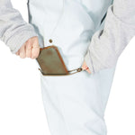 DC Women's Viva Shell Pant 2023 - Black pants with a subtle white pattern on the left leg, worn by a model from behind.