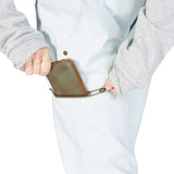 DC Women's Viva Shell Pant 2023 - Black pants with a subtle white pattern on the left leg, worn by a model from behind.