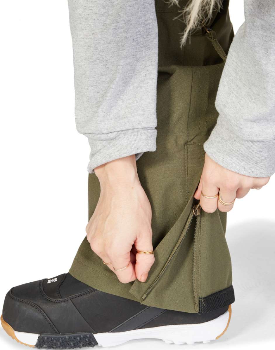 DC Women's Viva Shell Pant 2023 - Olive green pants with a zippered ankle and side pockets.