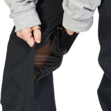 DC Women's Viva Shell Pant 2023 - Black pants with a zippered pocket on the side and a mesh lining visible through the fabric.