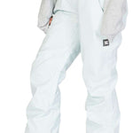 DC Women's Viva Shell Pant 2023 - Light blue snow pants with a subtle pattern of darker blue lines and white dots, featuring two gold buttons on the waistband.