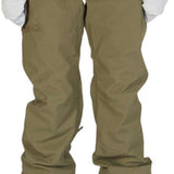 DC Women's Viva Shell Pant 2023 - Olive green pants with a subtle sheen and zippered pockets on both sides.