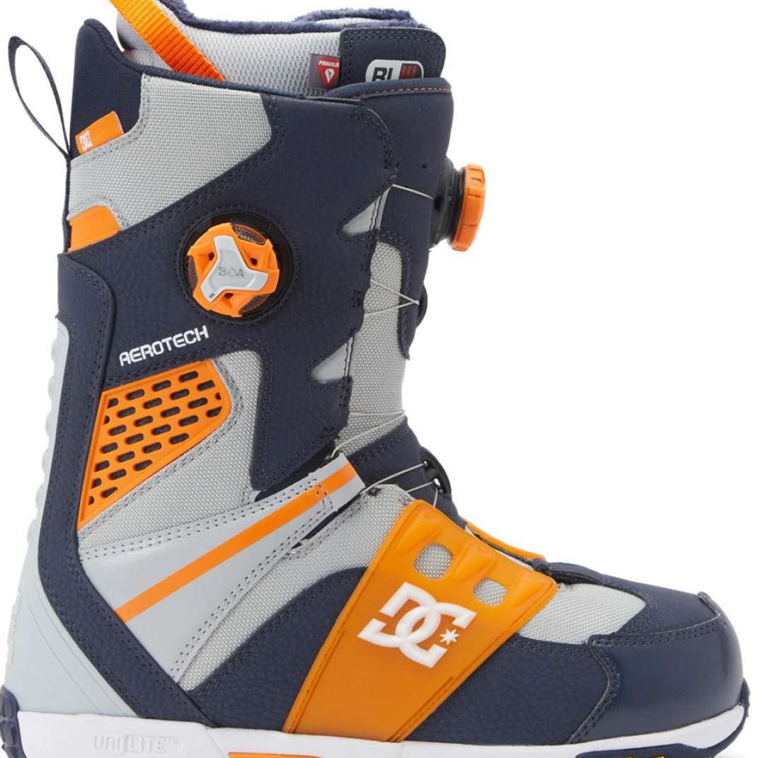 DC Phantom BOA Snowboard Boots 2024 - A pair of snowboard boots with a predominantly black upper and orange accents, featuring a white "BOA" logo on the side.