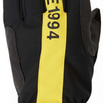 DC Salute Gloves 2024 - Black gloves with yellow accents on the wrist strap and fingers.