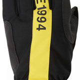 DC Salute Gloves 2024 - Black gloves with yellow accents on the wrist strap and fingers.