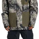 DC Servo Insulated Jacket - A black, white, and grey camouflage patterned jacket with a hood.