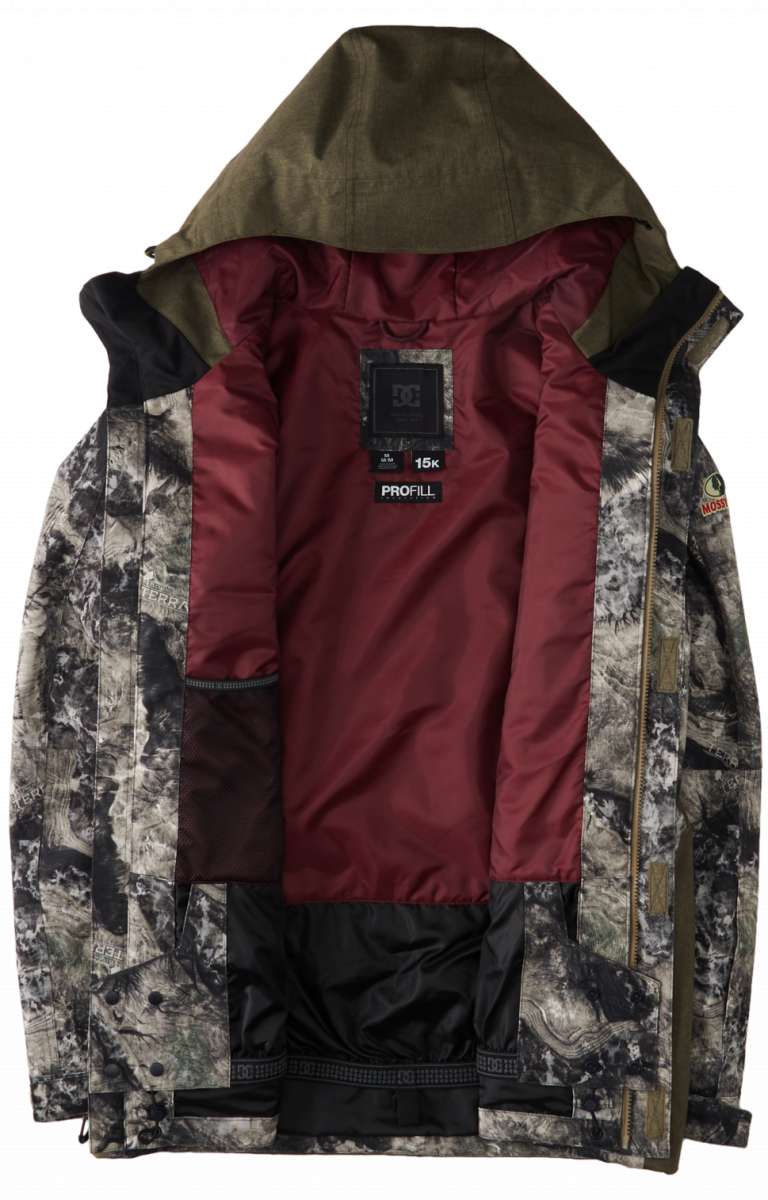 DC Servo Insulated Jacket 2024 - A black insulated jacket with a white and grey pattern of abstract shapes, featuring a hood and zippered pockets.