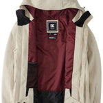 DC Servo Insulated Jacket 2024 - A cream-colored jacket with a black zipper and two zippered pockets on either side.