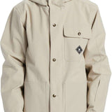 DC Servo Insulated Jacket 2024 - A cream-colored jacket with a hood, featuring two chest pockets and a black logo on the left side of the chest pocket.