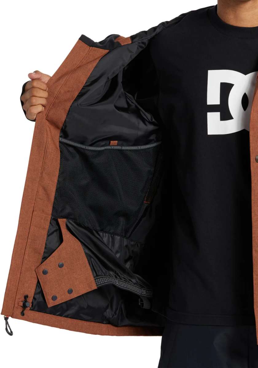 DC Servo Insulated Jacket 2024 - A brown jacket with a zippered chest pocket and black interior lining.