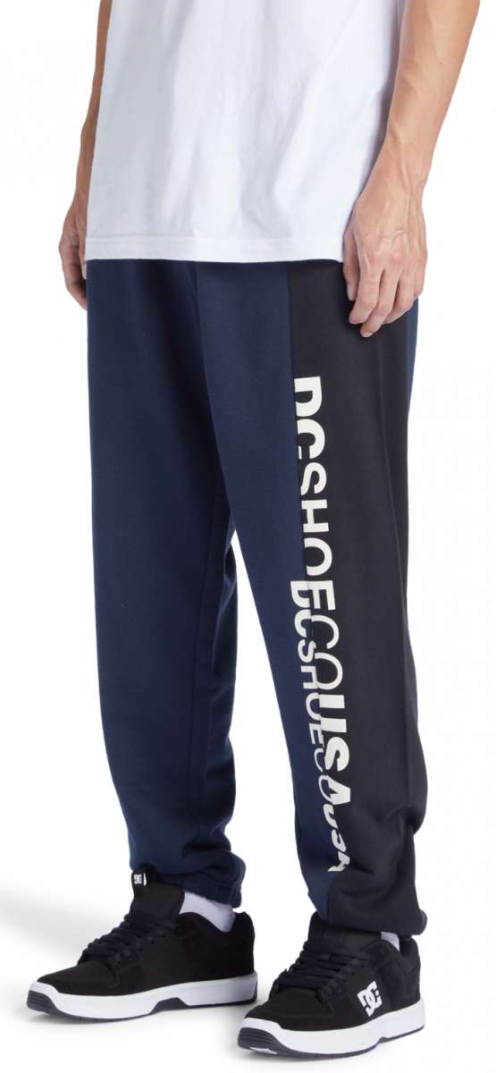 DC Static Sweatpants - Pair of navy blue sweatpants with white DC logo on left leg.