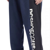 DC Static Sweatpants - Pair of navy blue sweatpants with white DC logo on left leg.