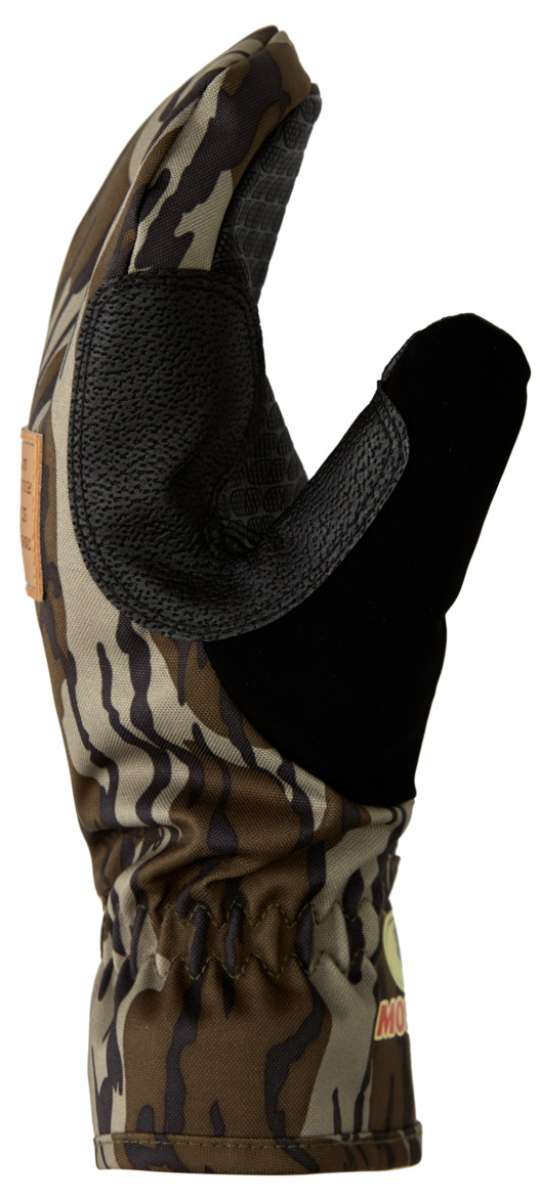 DC Tribute Mitt 2023 - A camouflage mitt with a textured palm and thumb, featuring a brown and green pattern.