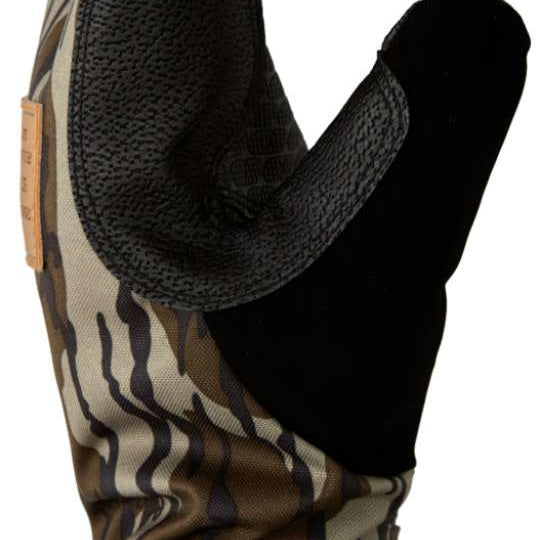 DC Tribute Mitt 2023 - A camouflage mitt with a textured palm and thumb, featuring a brown and green pattern.