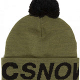 DC Youth Gambol Beanie 2024 - A green beanie with a black pom-pom on top.