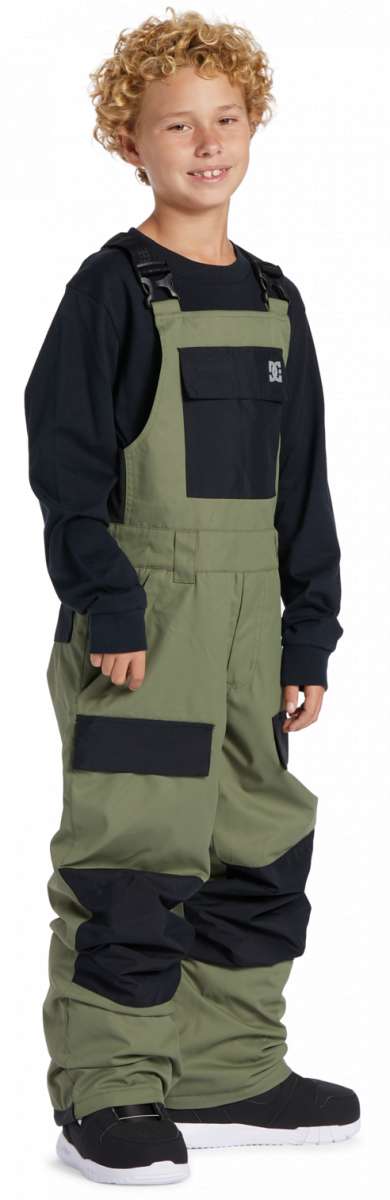 DC Youth Roadblock Insulated Bib 2024 - A pair of olive green and black insulated bib overalls with a white DC logo on the chest pocket.