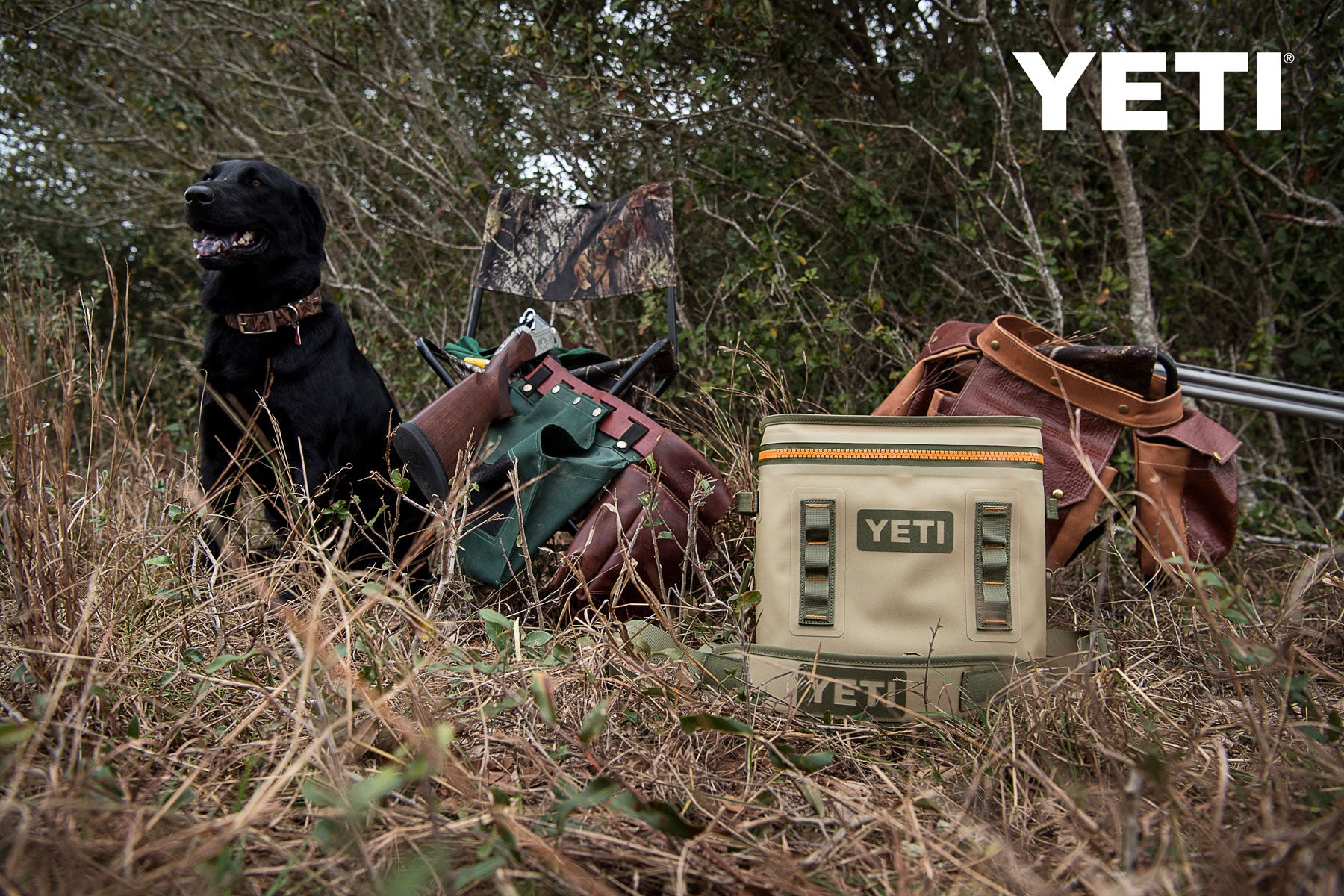 Yeti Hopper Flip 18 Personal Cooler - A tan cooler with a zipper and two handles, sitting on a wooden dock next to a boat.
