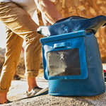 Hydro Flask Medium Dry Storage Bag - A medium-sized dry storage bag with a rectangular shape, featuring a zippered top and a handle on one side. It is primarily black in color.