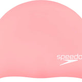 Speedo Elastomeric Solid Silicone Swim Cap - A solid pink swim cap made of silicone, featuring a smooth texture and no visible patterns or logos.