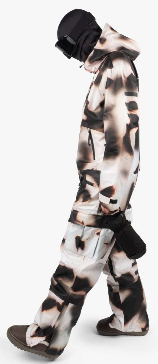 Endeavor 3L Shelter One Piece Suit 2024 - A black and white snowsuit with a geometric pattern of abstract shapes, featuring a hood and zippered pockets.