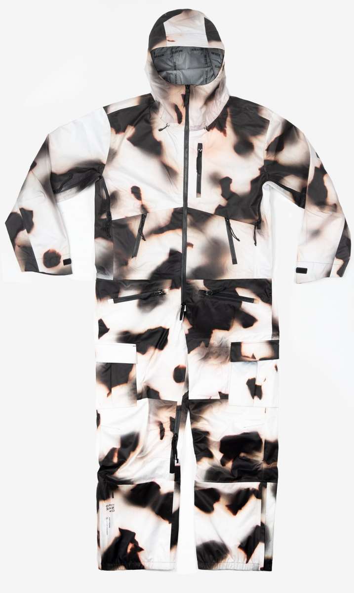 Endeavor 3L Shelter One Piece Suit 2024 - A black and white snowsuit with a camouflage pattern, featuring a hood and zippered pockets.