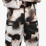 Endeavor 3L Shelter One Piece Suit 2024 - A black, white, and brown snowsuit with a zippered front and adjustable cuffs.